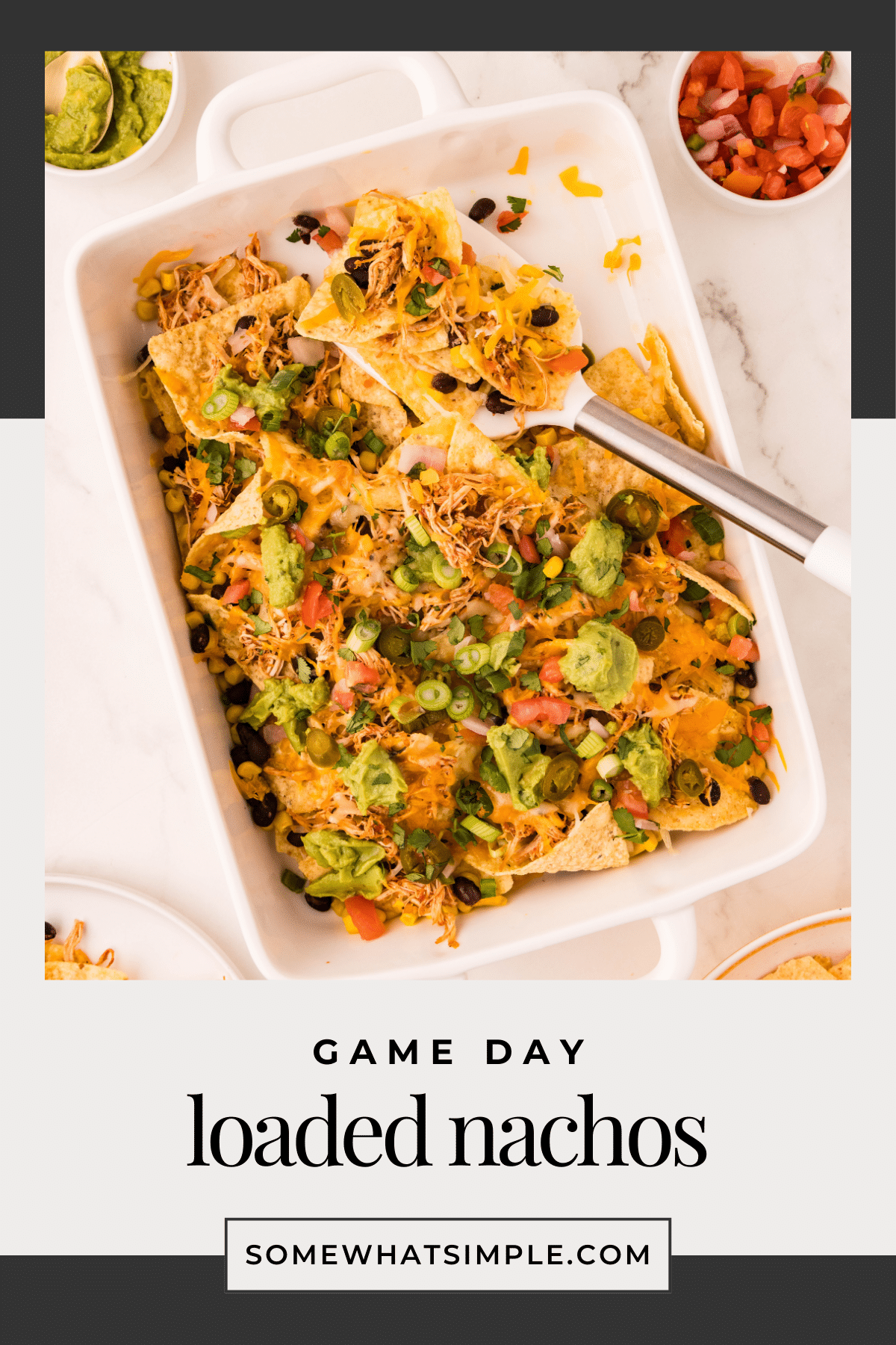Nothing says game day like a giant pan of loaded nachos! These nachos are packed with flavor, easy to make, and perfect for feeding a crowd. Instead of traditional taco meat, we're using crock pot shredded chicken for a juicy, flavorful twist. via @somewhatsimple