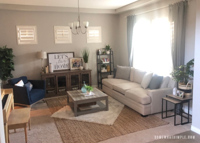 a living room with a couch and a piano