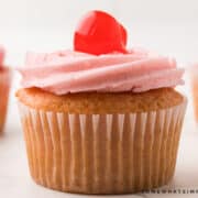 close up of a vanilla cherry cupcake