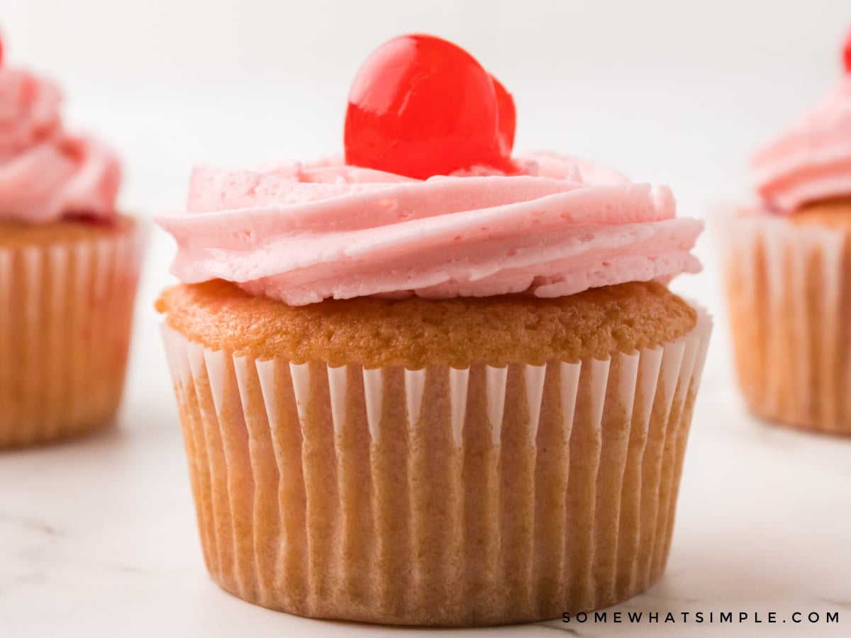 close up of a vanilla cherry cupcake