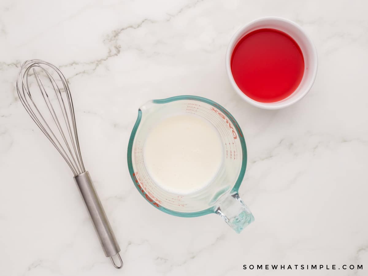 adding cherry juice to a measuring cup