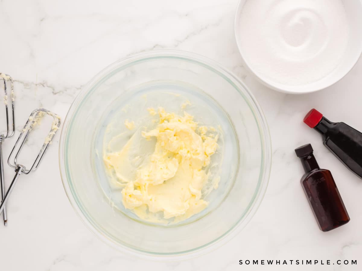 beating butter in a glass bowl