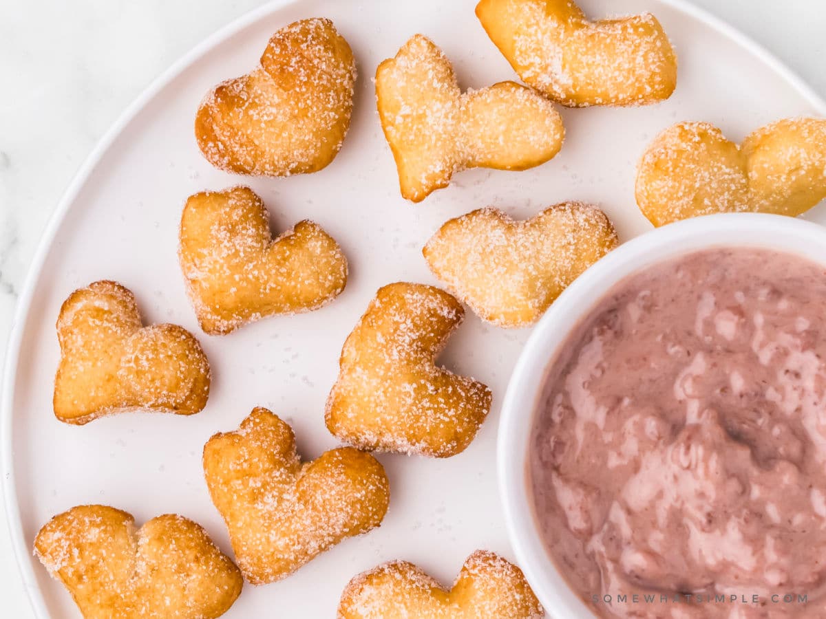 sugared heart donuts with strawberry sauce