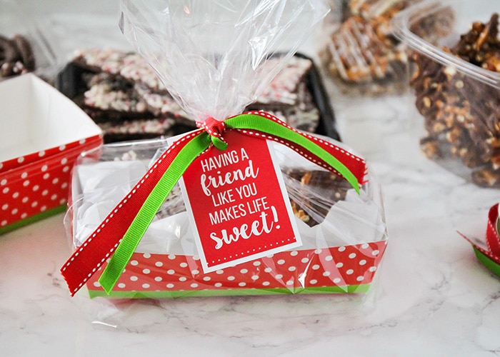 a christmas gift basket wrapped with a printable tag