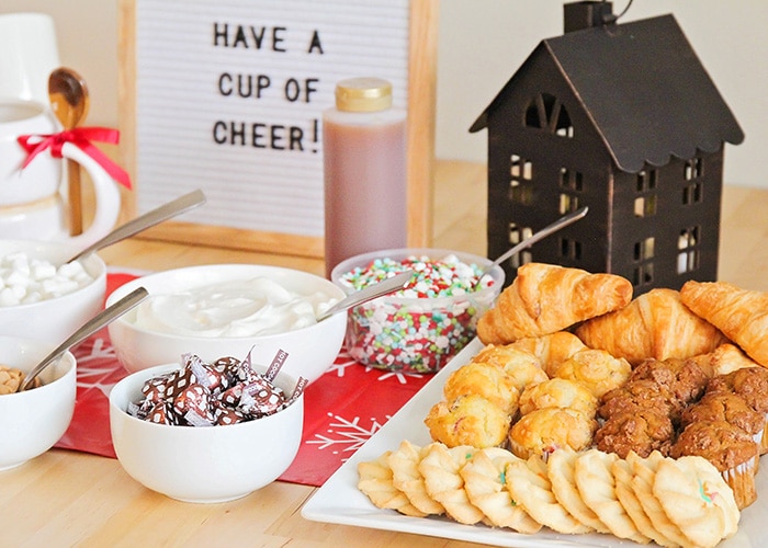 toppings and cookies that are part of a hot cocoa bar