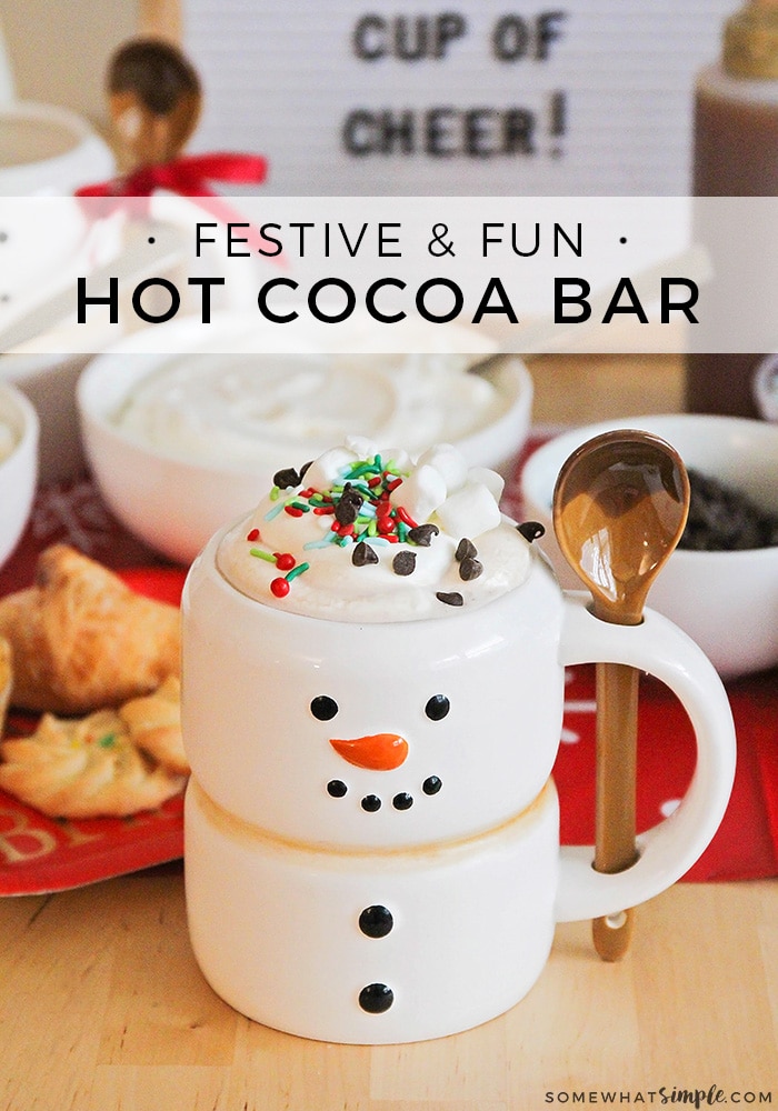 This sweet hot cocoa bar is a fun way to celebrate the season! Set out mix-ins, serve treats on the side, and enjoy a cup of holiday cheer! It's perfect to serve at your next holiday party or set it out for the family as a Christmas treat. via @somewhatsimple