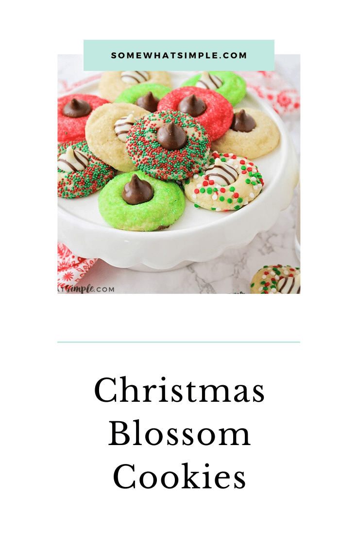 These Christmas blossom cookies are a fun and delicious way to spread some holiday cheer!  Made with your favorite sugar cookie dough, Christmas decorations and a Hershey's Kiss, these cookies are irresistible! These are so easy, they take only minutes to prepare but look like you've been baking all day! via @somewhatsimple