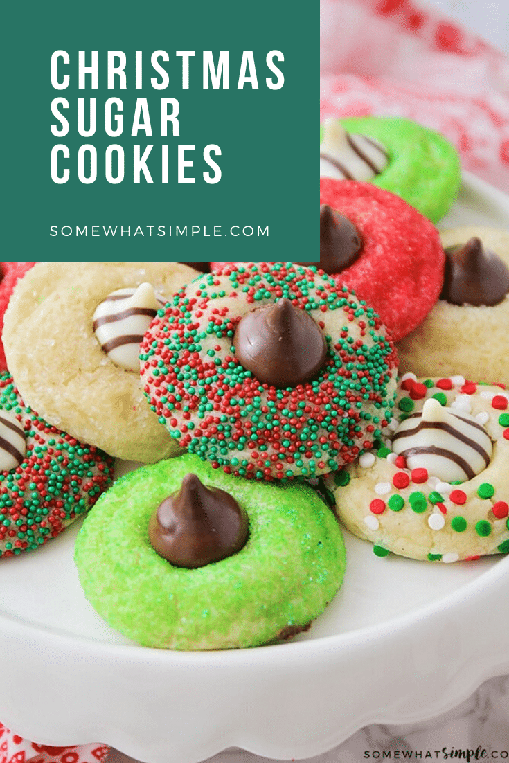 These Christmas blossom cookies are a fun and delicious way to spread some holiday cheer!  Made with your favorite sugar cookie dough, Christmas decorations and a Hershey's Kiss, these cookies are irresistible! These are so easy, they take only minutes to prepare but look like you've been baking all day! via @somewhatsimple