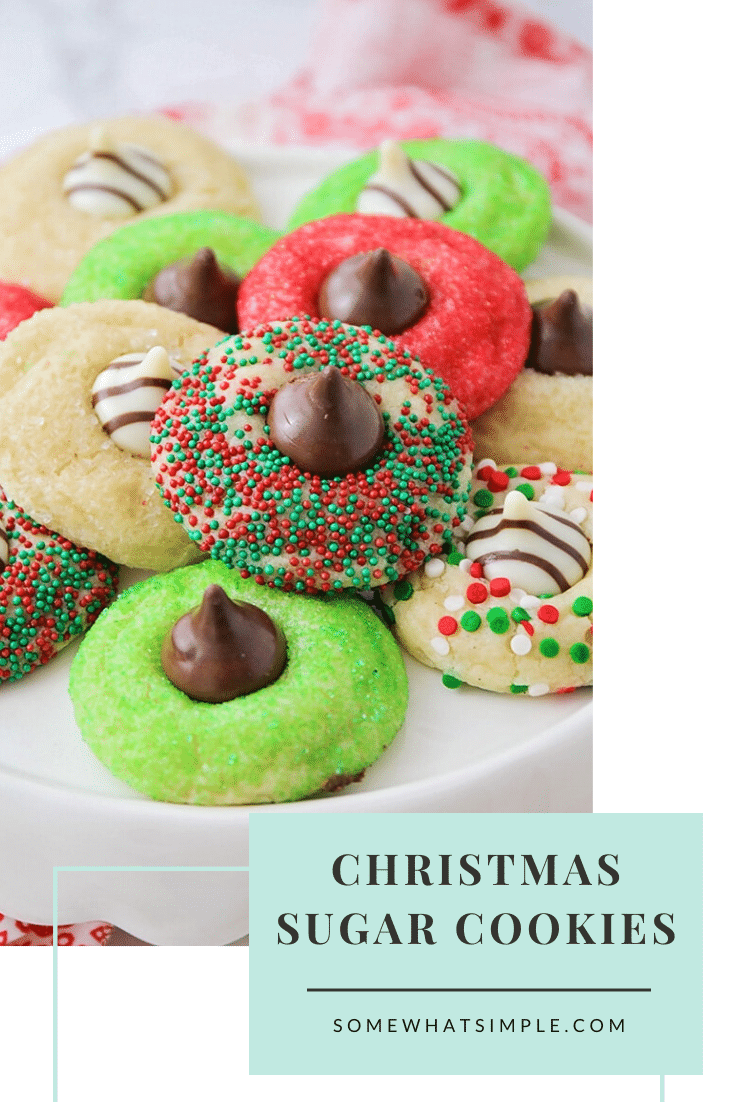 These Christmas blossom cookies are a fun and delicious way to spread some holiday cheer!  Made with your favorite sugar cookie dough, Christmas decorations and a Hershey's Kiss, these cookies are irresistible! These are so easy, they take only minutes to prepare but look like you've been baking all day! via @somewhatsimple