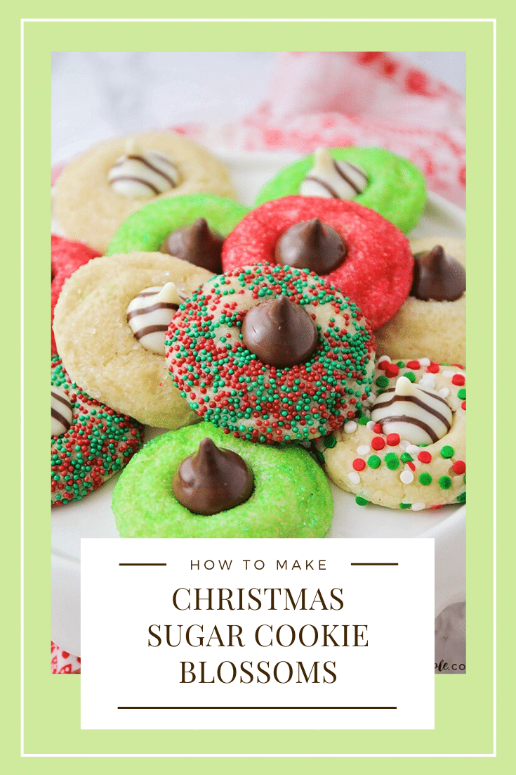 These Christmas blossom cookies are a fun and delicious way to spread some holiday cheer!  Made with your favorite sugar cookie dough, Christmas decorations and a Hershey's Kiss, these cookies are irresistible! These are so easy, they take only minutes to prepare but look like you've been baking all day! via @somewhatsimple