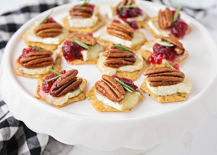 Cranberry Brie Appetizer Bites on a white serving plate are an easy super bowl appetizer to make