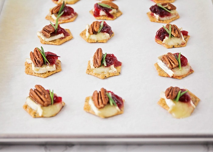 These cranberry brie appetizer bites are super flavorful, and so quick to make. They're a festive and delicious holiday appetizer!