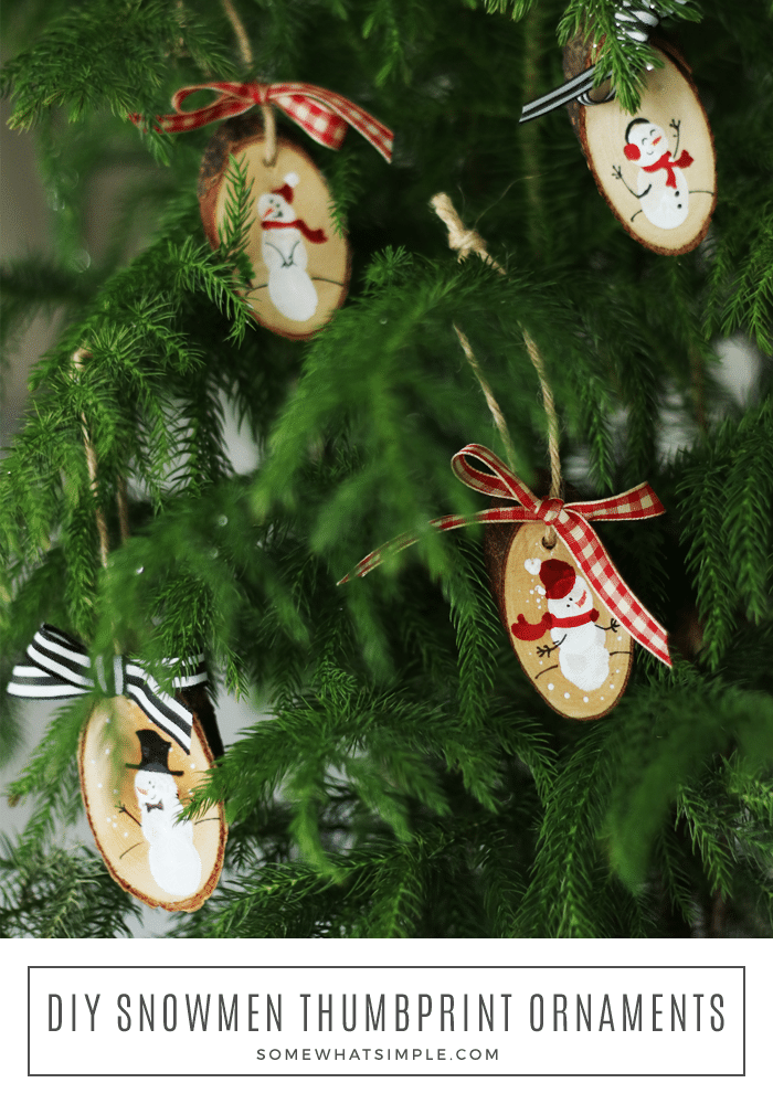 These adorable diy snowman ornaments made with your child's fingerprints are the perfect keepsake for parents, grandparents, etc! And with a drop or two of essential oils, it makes a great air freshener as well! #keepsake #christmas #ornament #giftidea #kidcraft #snowman #ornament #diy #diyornament #christmascraft via @somewhatsimple