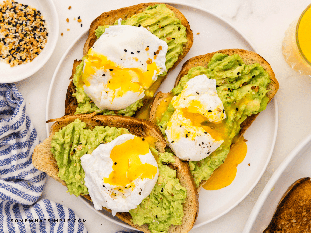 avocado toast plated with Poached Eggs on top
