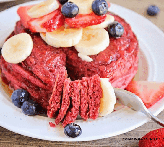 cutting a slice out of Red Velvet Pancakes