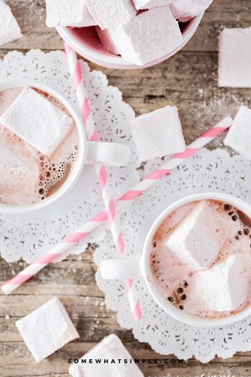 overhead shot of 2 mugs filled with hot cocoa