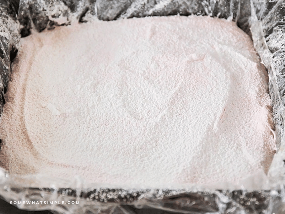 a pan of Strawberry Marshmallows dusted with powdered sugar