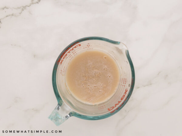 yeast setting in a glass measuring cup