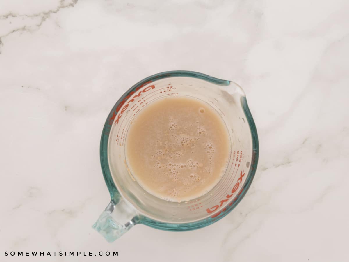 yeast setting in a glass measuring cup