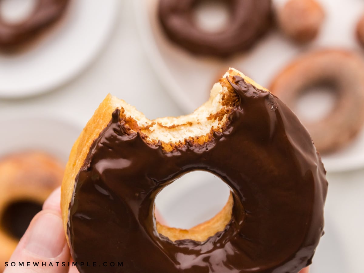 a bite taken out of a chocolate donut