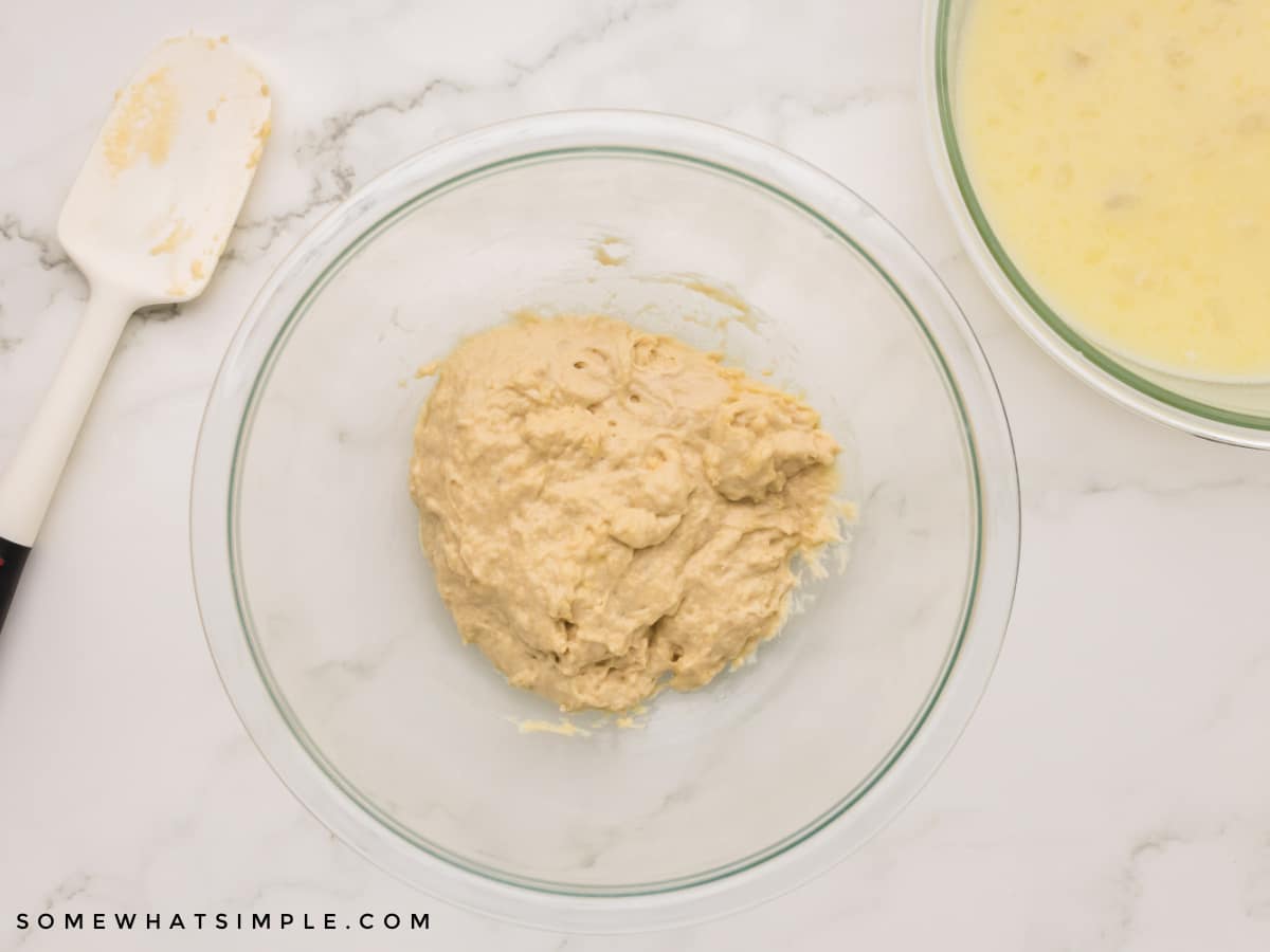 wet donut dough in a glass bowl