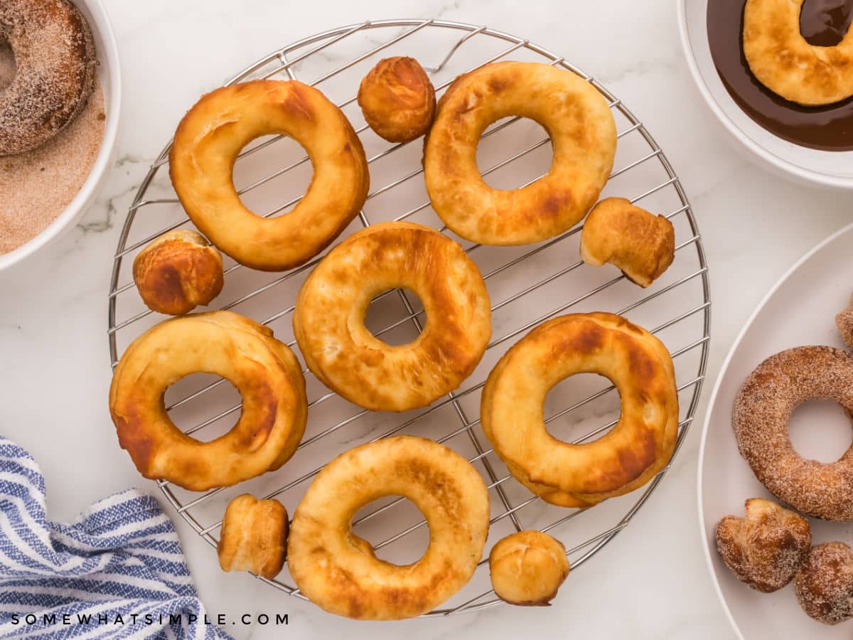 fried homemade donuts on a cooling rack