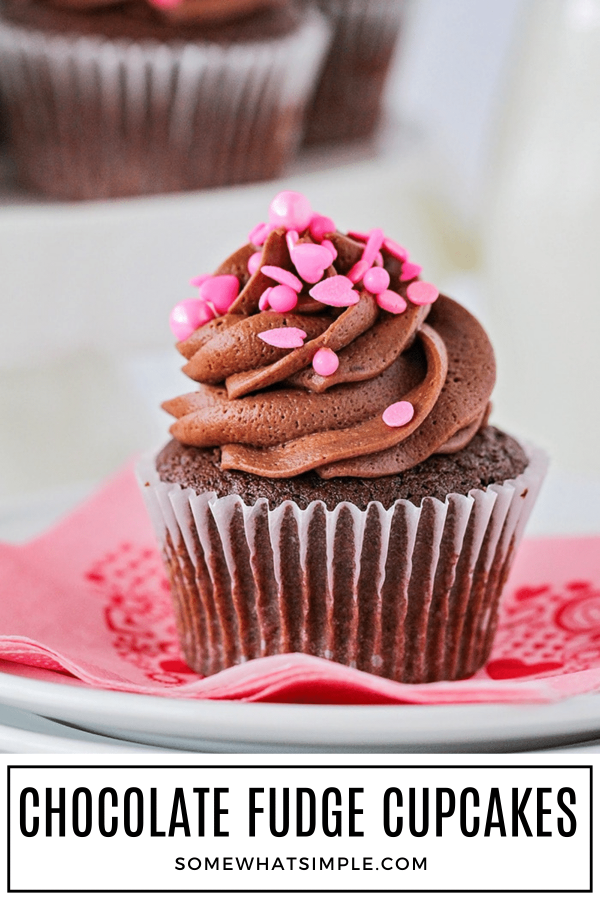 Make the best chocolate fudge cupcakes with a creamy strawberry filling. This simple recipe is easy, delicious, and always a crowd favorite. via @somewhatsimple
