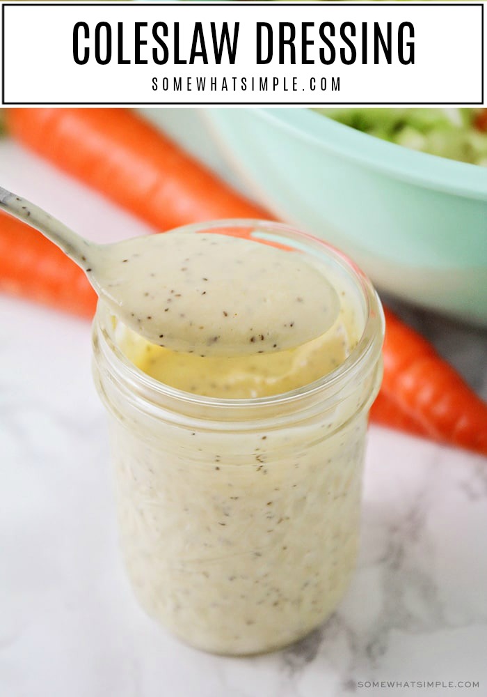 a close up of a jar of the best Homemade Coleslaw Dressing with a spoon full of dressing over the top of the jar. The words coleslaw dressing is in a white box at the top of the image