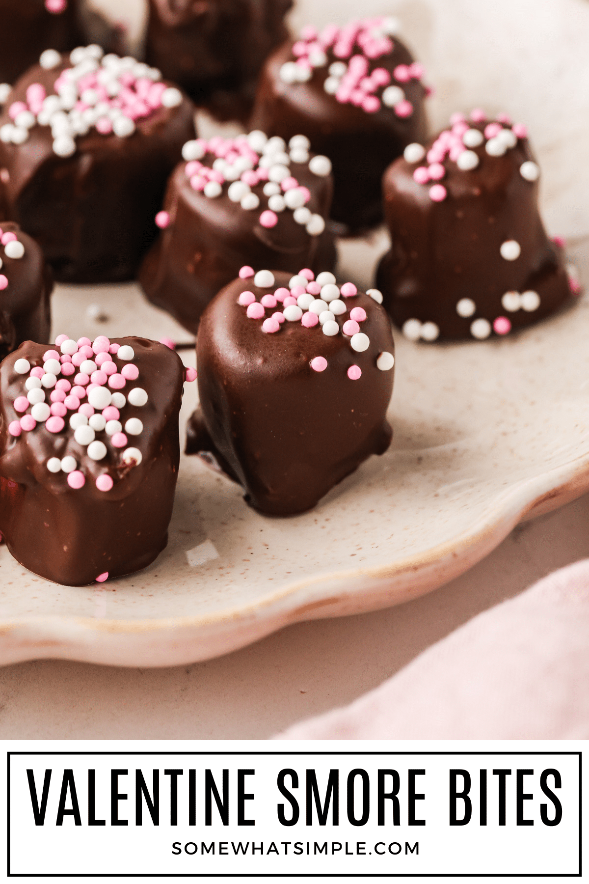 These Valentine S’more Bites are an easy no-bake treat made with just 4 ingredients. Cute, chocolatey, and perfect for Valentine’s Day. via @somewhatsimple