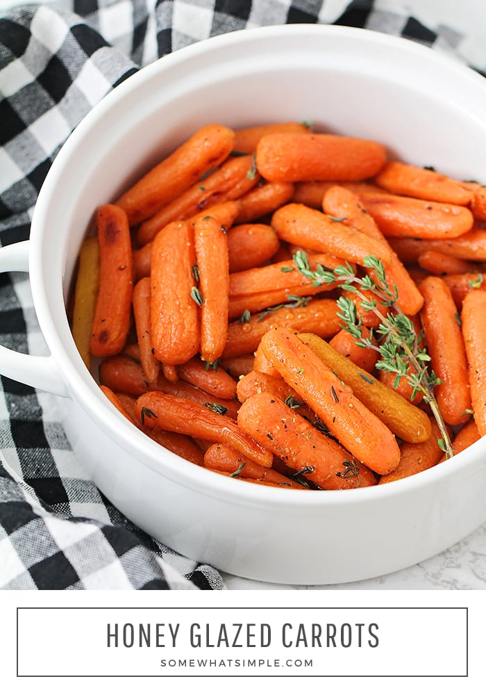 a white serving bowl that is filled with honey glazed carrots that have been baked and topped with thyme. A black and white checkered napkin is laying next to the bowl on the counter. The words honey glazed carrots are written in a white box at the bottom of the image