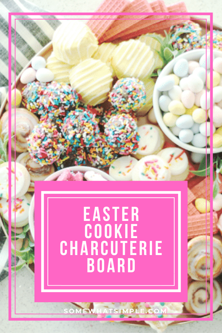 Piled high with cookies, baked goods and candies, this cookie charcuterie board is a beautiful way to serve dessert at your next celebration! Fill the tray with pastel colored cookies that are perfect for Easter or change it up to fit any occasion. #charcuterie #dessertcharcuterie #cookies #platter #party #food via @somewhatsimple