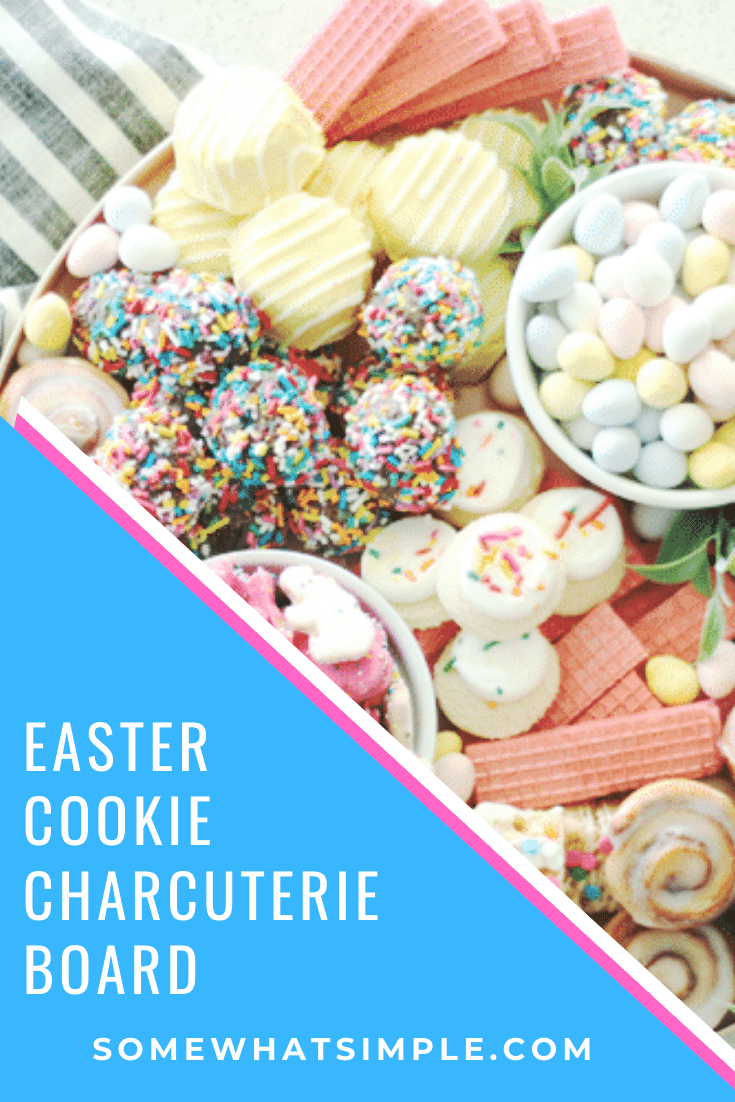 Piled high with cookies, baked goods and candies, this cookie charcuterie board is a beautiful way to serve dessert at your next celebration! Fill the tray with pastel colored cookies that are perfect for Easter or change it up to fit any occasion. #charcuterie #dessertcharcuterie #cookies #platter #party #food via @somewhatsimple