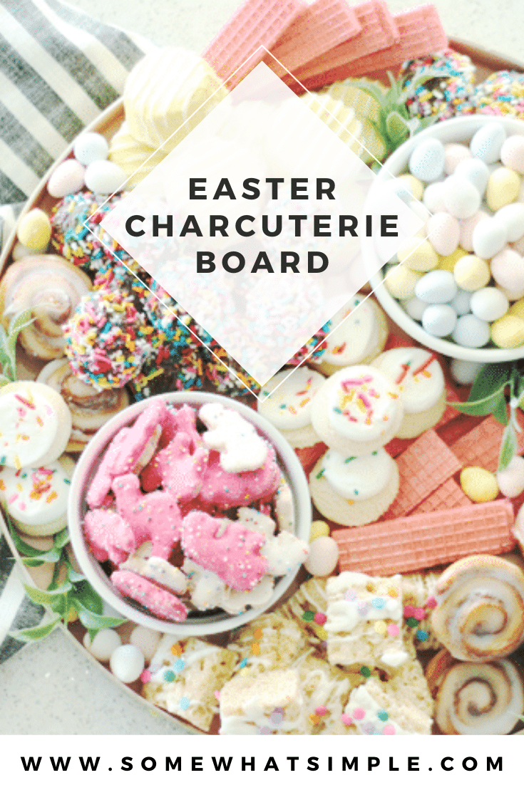 Piled high with cookies, baked goods and candies, this cookie charcuterie board is a beautiful way to serve dessert at your next celebration! Fill the tray with pastel colored cookies that are perfect for Easter or change it up to fit any occasion. #charcuterie #dessertcharcuterie #cookies #platter #party #food via @somewhatsimple