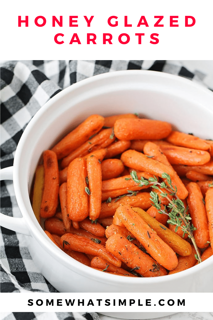 Honey glazed carrots make a simple side dish that is delicious, healthy, and so easy to make!  Drizzle these roasted carrots in a honey and olive oil glaze that will make them irresistibly sweet! These are the perfect side dish for your holiday dinner or just something different any day of the week. via @somewhatsimple