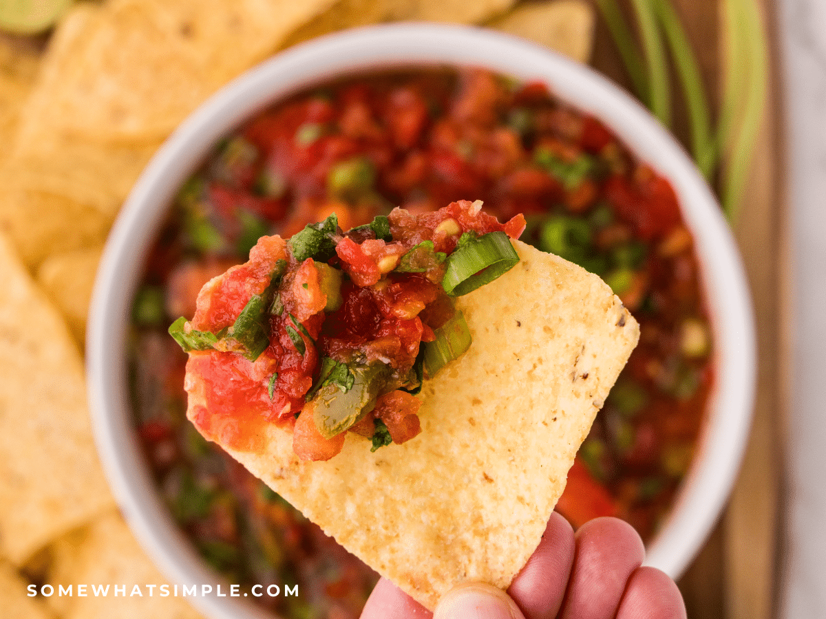 Scooping Mild Salsa onto a chip
