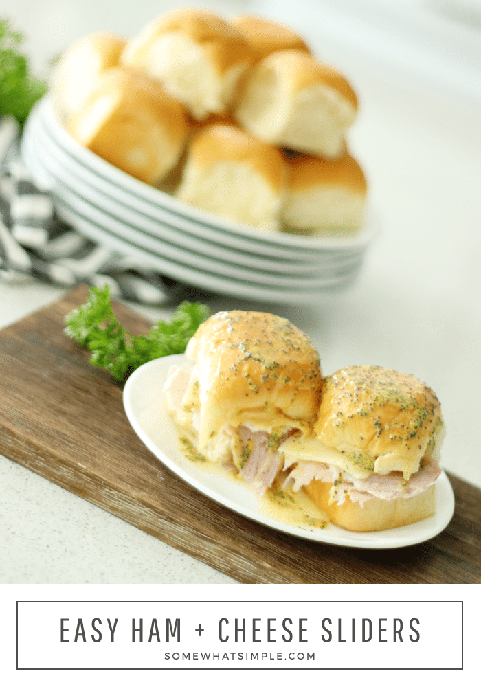 Juicy ham and Swiss cheese inside soft Hawaiian rolls brushed with a buttery topping that's baked is absolutely delicious! These Ham and Cheese Sliders are perfect as a simple dinner or feeding a crowd and could not be any easier to make! #hamsliders #hamandswisssliders #howtomakehamandcheesesliders #hamandcheesesliderrecipe #hawaiianrollhamsliders via @somewhatsimple