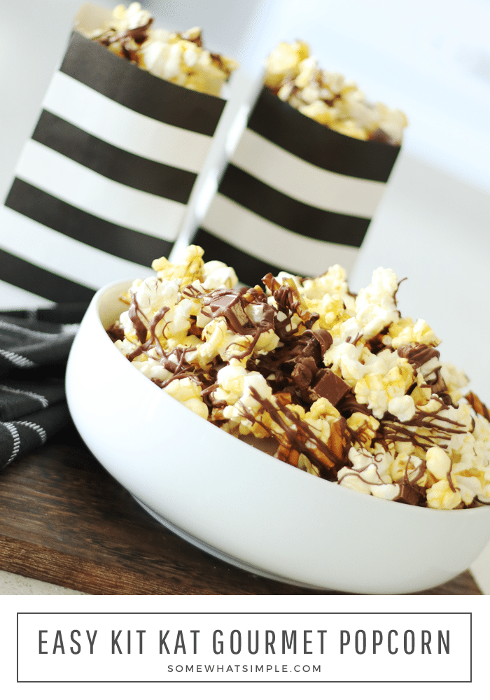 This gourmet Kit Kat popcorn recipe is full of pretzels, candy bars, melted chocolate and buttery popcorn! It is the perfect combination of salty and sweet and is definitely the ultimate snack in a bowl. #gourmetpopcornrecipe #homemadegourmetpopcorn #kitkat #gourmetpopcorn #movienight #gourmetpopcornrecipe via @somewhatsimple