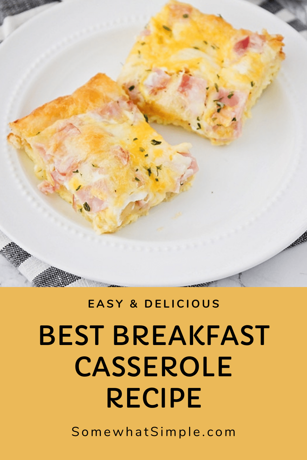 This easy croissant breakfast egg casserole recipe is an easy recipe that is perfect for either breakfast or dinner! Made with eggs, ham (or sausage) and melted cheese baked over a croissant crust that is a perfect way to start the morning! Plus, it only takes minutes to prepare, so you'll have a delicious breakfast in no time! via @somewhatsimple