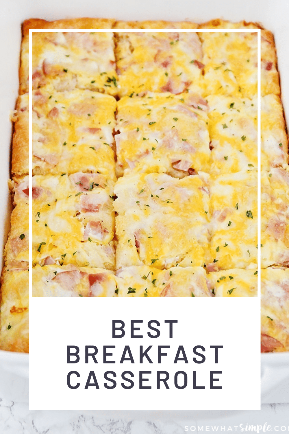 This easy croissant breakfast egg casserole recipe is an easy recipe that is perfect for either breakfast or dinner! Made with eggs, ham (or sausage) and melted cheese baked over a croissant crust that is a perfect way to start the morning! Plus, it only takes minutes to prepare, so you'll have a delicious breakfast in no time! via @somewhatsimple