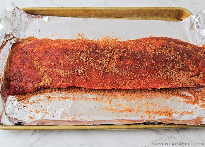 a full rack of ribs covered in a homemade seasoning rub