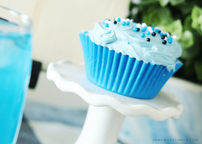 blue cupcake on a white stand for a fun family dinner