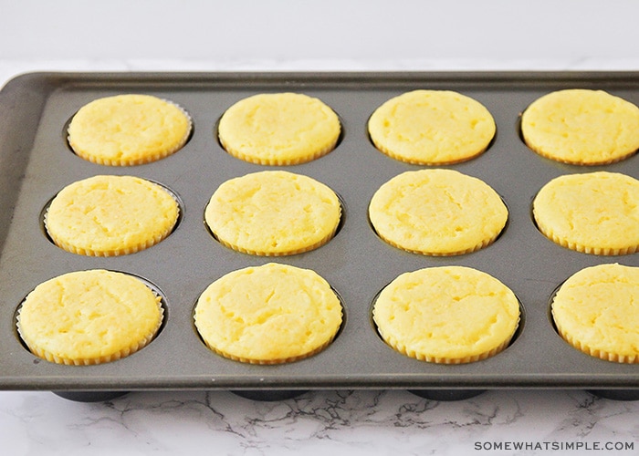 baked yellow lemon cupcakes fresh out of the oven in a cupcake pan