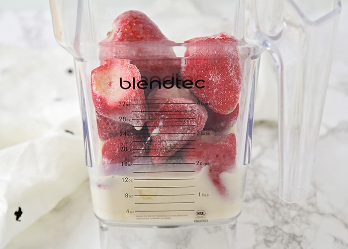 frozen strawberries in a blender