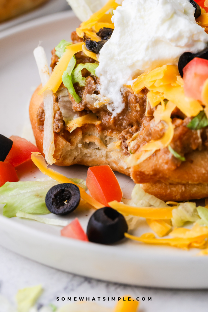 close up of a bite out of a Navajo Taco