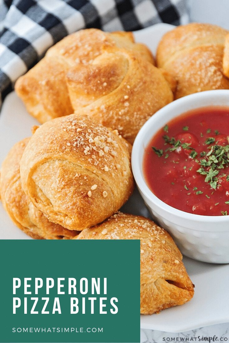 These mini homemade pizza bites are a simple meal or snack that can feed a small family or a large crowd!  Filled with cheese, pepperoni or any of your other favorite pizza toppings, this easy recipe will make everyone happy.  #pizza #pizzabites #howtomakehomemadepizzabites #minipizzabites #homemadepizzabites via @somewhatsimple