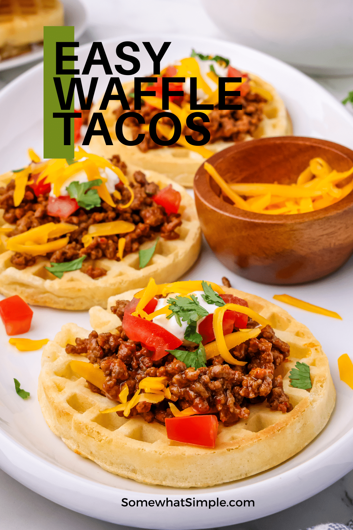 Waffle Tacos are the best of both taco worlds! The crisp edges give it the crunch of a hard shell taco, but the soft inside gives it the chewiness of a soft taco. Everyone gets fed, and everyone is happy! #waffles #tacos #easydinner #vegetarian #glutenfree via @somewhatsimple