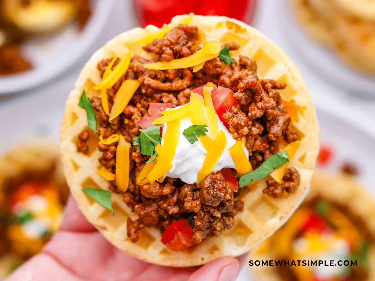 hand holding a waffle taco