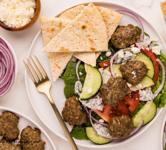 gyro salad plated on a white plate
