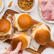 Hawaiian Ham Sandwiches on a brown serving platter