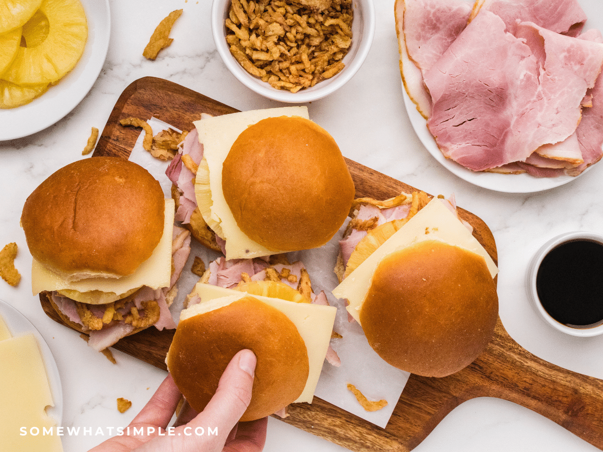 Hawaiian Ham Sandwiches on a brown serving platter